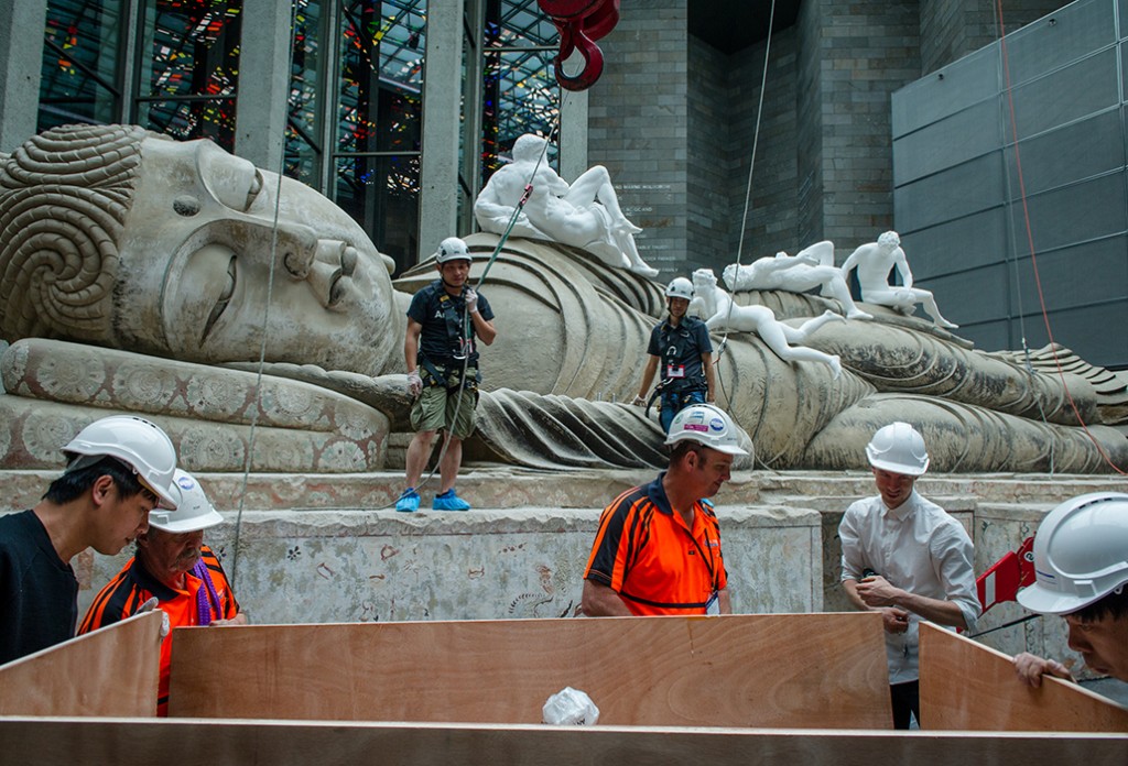 The final elements of "Eternity Buddah in Nirvana" by Chinese artist Xu Zhen being installed at the NGV. Picture: Eugene Hyland