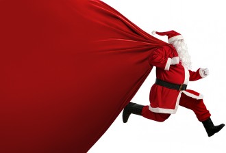 Santa Claus with a huge bag on the run