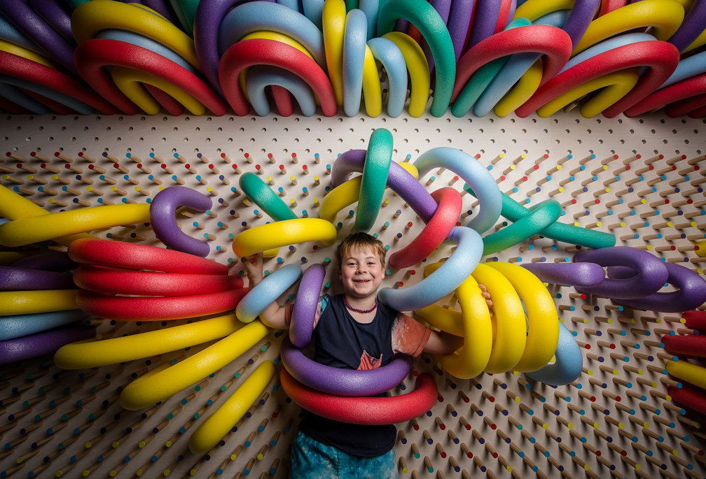 Installation view of visitors enjoying We Make Carpets’ Hand on: We Make Carpets for Kids display at NGV Triennial at NGV International, 2017, Photo: Eugene Hyland