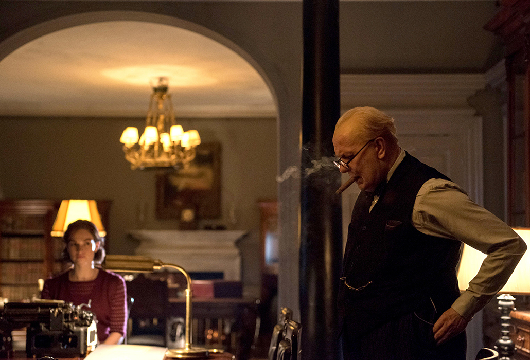 Lily James stars as Elizabeth Layton and Gary Oldman as Winston Churchill in director Joe Wright's DARKEST HOUR, a Focus Features release. Photographer Jack English