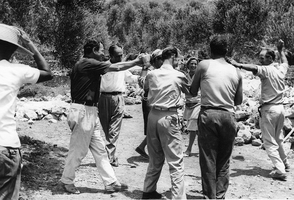 Patrick Leigh Fermor dancing with the builders during the construction of the house in Kardamyli, 1965. Photo: Joan Leigh Fermor. National Library of Scotland, Joan Leigh Fermor Photographic Collection. © Estate of Joan Leigh Fermor