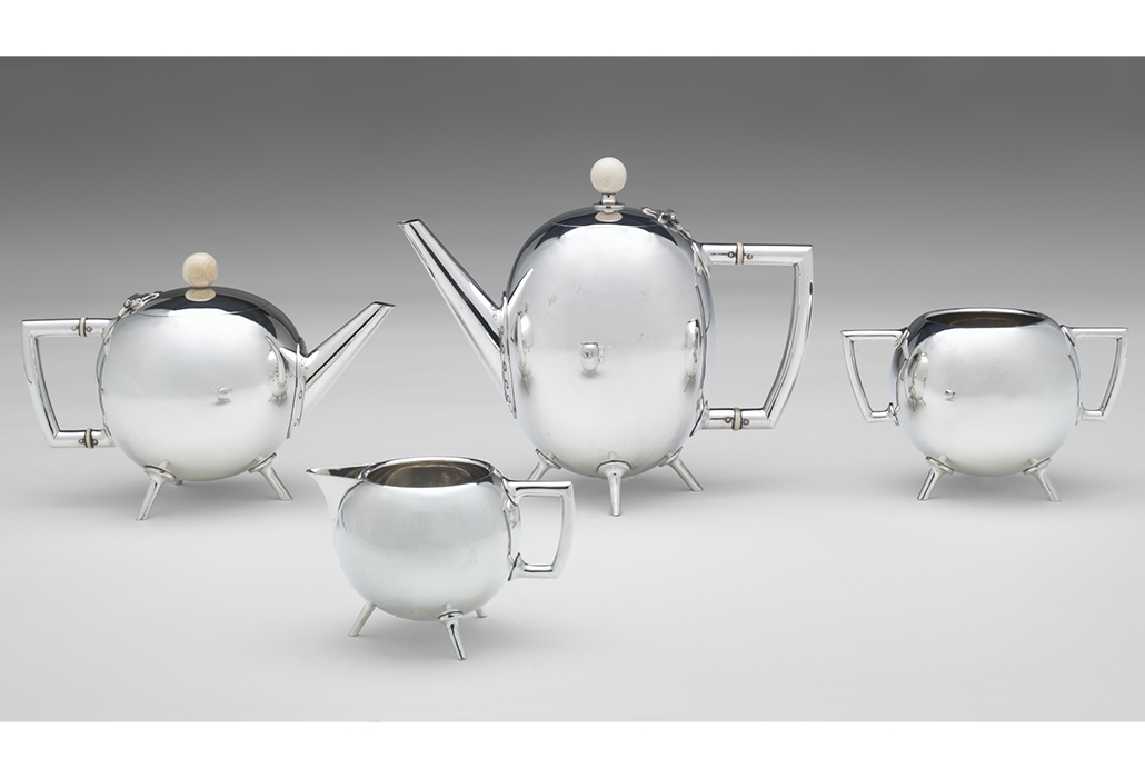 Christopher Dresser (designer); Hukin & Heath, Birmingham (manufacturer) Tea service 1879 silver electroplate, ivory (a) 17.7 x 22.0 x 11.3 cm (hot water jug) (b) 13.2 x 19.6 x 11.1 cm (teapot) (c) 9.4 x 15.0 x 10.0 cm (sugar bowl) (d) 6.9 x 11.2 x 7.6 cm (milk jug) National Gallery of Victoria, Melbourne Purchased through the NGV Foundation with the assistance of Mr Hugh Morgan AC, Governor, 2002
