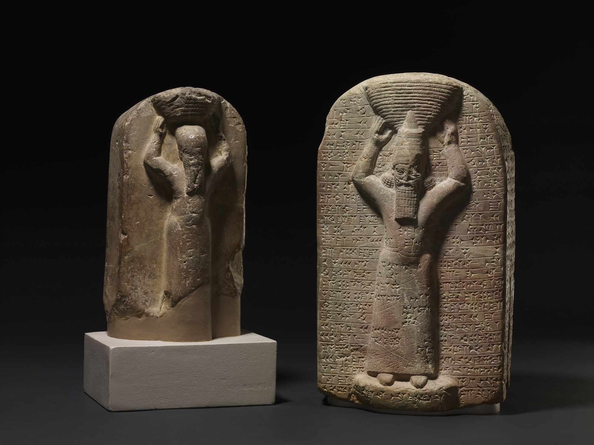 Shamash-shumu-ukin and Ashurbanipal Stone stele depicting Ashurbanipal (right), shown with a ritual basket on his head with cuneiform inscription, South Iraq, Marduk temple (Babylon), 668BC-665BC. His brother Shamash-shumu-ukin (left) carved with cuneiform inscription, South Iraq, Temple of Nabu (Borsippa), 668BC- 655BC © The Trustees of the British Museum