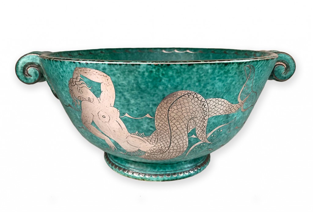 An Exceptional early Art Deco signed Argenta dish with sterling silver inlay depicting an intricate decoration of a mermaid on both sides Designer Wilhelm Kage for Gustavberg Sweden Date C1930. This is a rare piece due to its large size. There is a similar piece in the National Museum in Stockholm, courtesy Virtanen Antiques