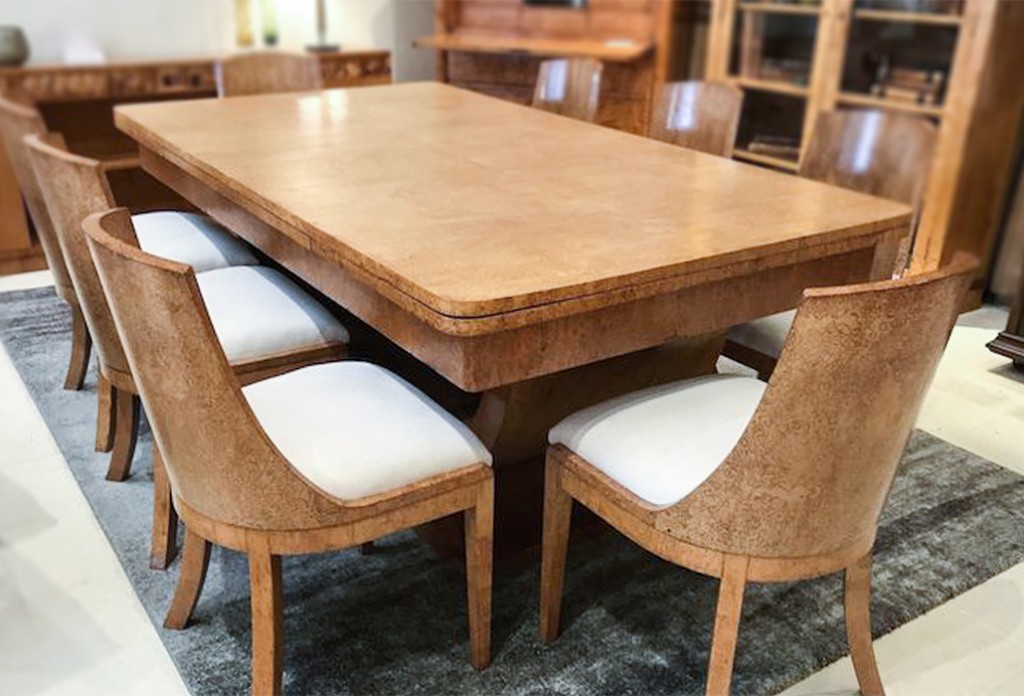 Magnificent Karelian Birch Art Deco dining table with two extensions to three meters. With eight matching solid curved back chairs which have been reupholstered in a macro suede fabric. The table has a ‘C” curved support which rests on a shaped base. Date C1930, courtesy Virtanen Antiques