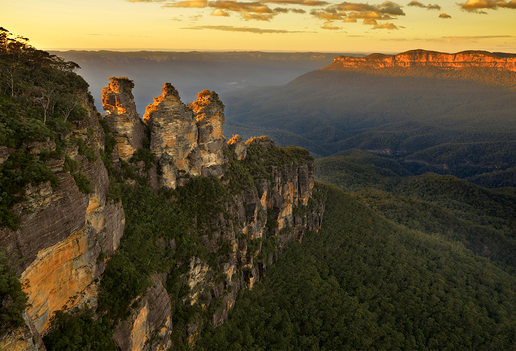 View over the landmark rock formation "Three sisters" in Blue Mountains, NSW, Australia on sunrise.