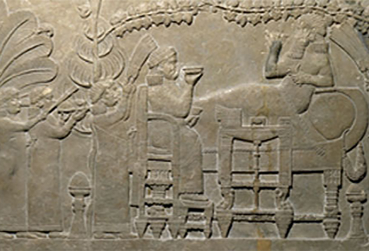 King Ashurbanipal of Assyria feasting