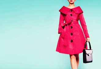 Red coat woman with black leather handbag. Beautiful vintage style.