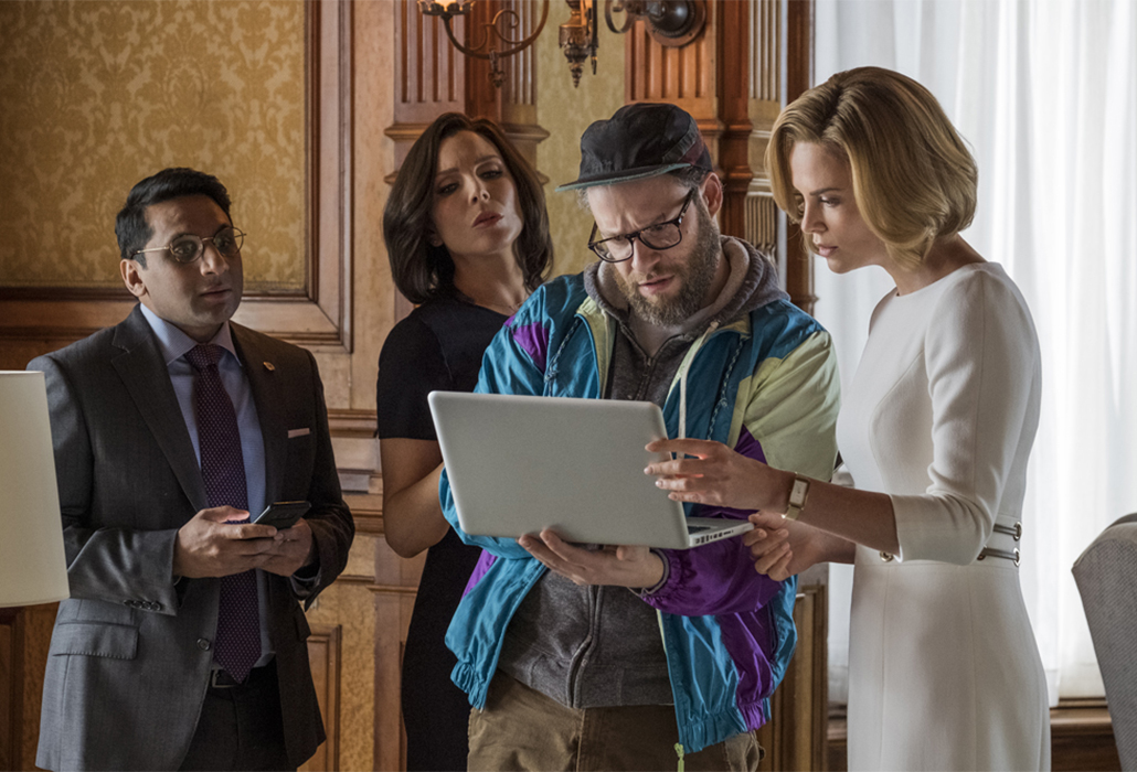 Tom (RAVI PATEL), Maggie (JUNE DIANE RAPHAEL), Fred Flarsky (SETH ROGEN), and Charlotte Fields (CHARLIZE THERON) in LONG SHOT. Photo Credit: Philippe Bossé.