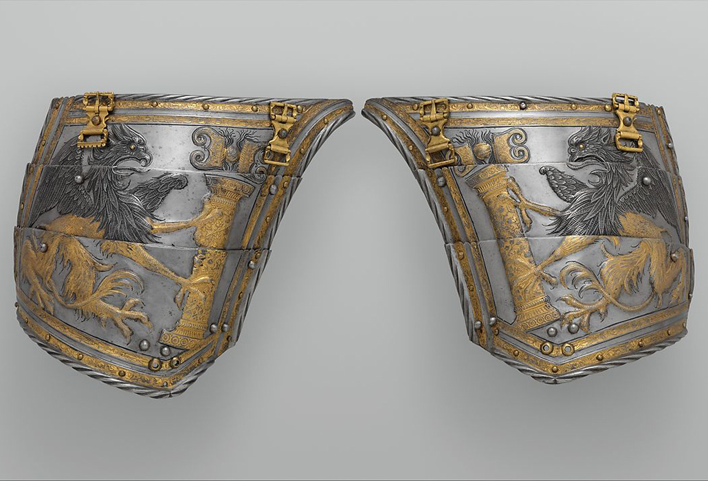 Kolman Helmschmid (German, Augsburg 1471–1532) Pair of Tassets of Emperor Charles V (1500–1558), ca. 1530–40 Germany, Augsburg, Steel, gold; L. of each 8 3/4 in. (22.23 cm); W. of each 9 3/8 in. (23.8 cm); Wt. of right tasset 1 lb. 1 oz. (482 g); Wt. of left tasset 1 lb. 2 oz. (510 g) The Metropolitan Museum of Art, New York, Bashford Dean Memorial Collection, Bequest of Bashford Dean, 1928