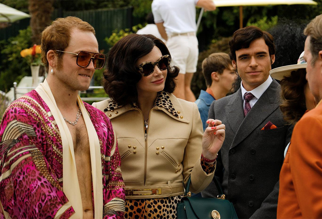 Taron Egerton as Elton John with Richard Madden as Alan Reid and Bryce Dallas Howard in Rocketman from Paramount Pictures