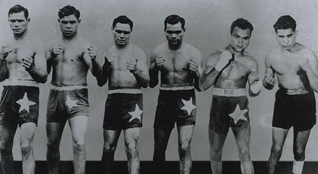 The six Sands brothers in fighting poses - Clem, Ritchie, George, Dave, Alf and Russell, 1943-1952 (Courtesy National Library of Australia, https://nla.gov.au/nla.obj-148524597)