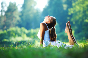 bigstock_yoga_woman_on_gree