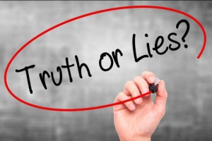 Man Hand writing Truth or Lies with black marker on visual screen