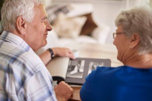 elder couple reminiscing their past