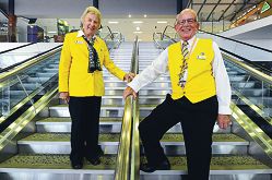 Perth International Airport Gold Coat volunteers Bernice Campbell and Paul Headley. Picture: Marcus Whisson d400604