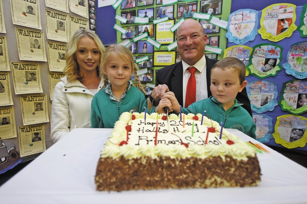 Former Halls Head Primary School student Lauren Holt with Jayla, principal Peter Beckingham and Jacob Towie. Picture: Jon Hewson www.communitypix.com.au d437960