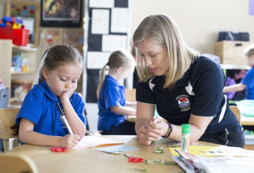 Teacher Working With Kindy Student