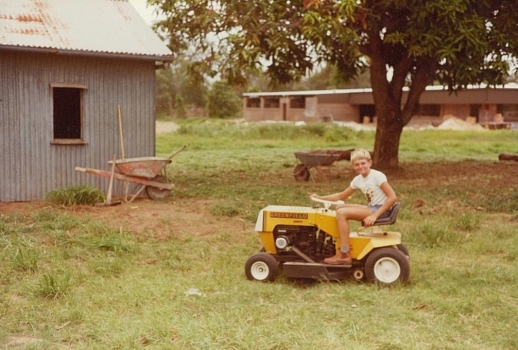 1980 Neil Lewis Mowing Around Mango Tree