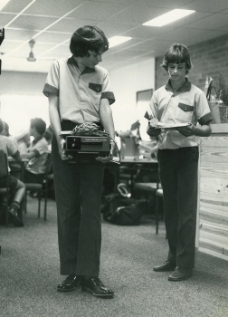 1981 Boys Carry Projector In Library