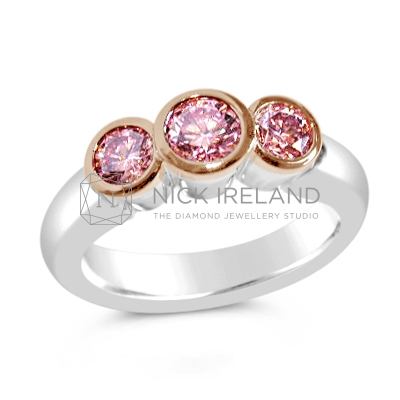 DJSP4/ Platinum and Rose Gold Argyle Pink 3 stone Diamond Ring