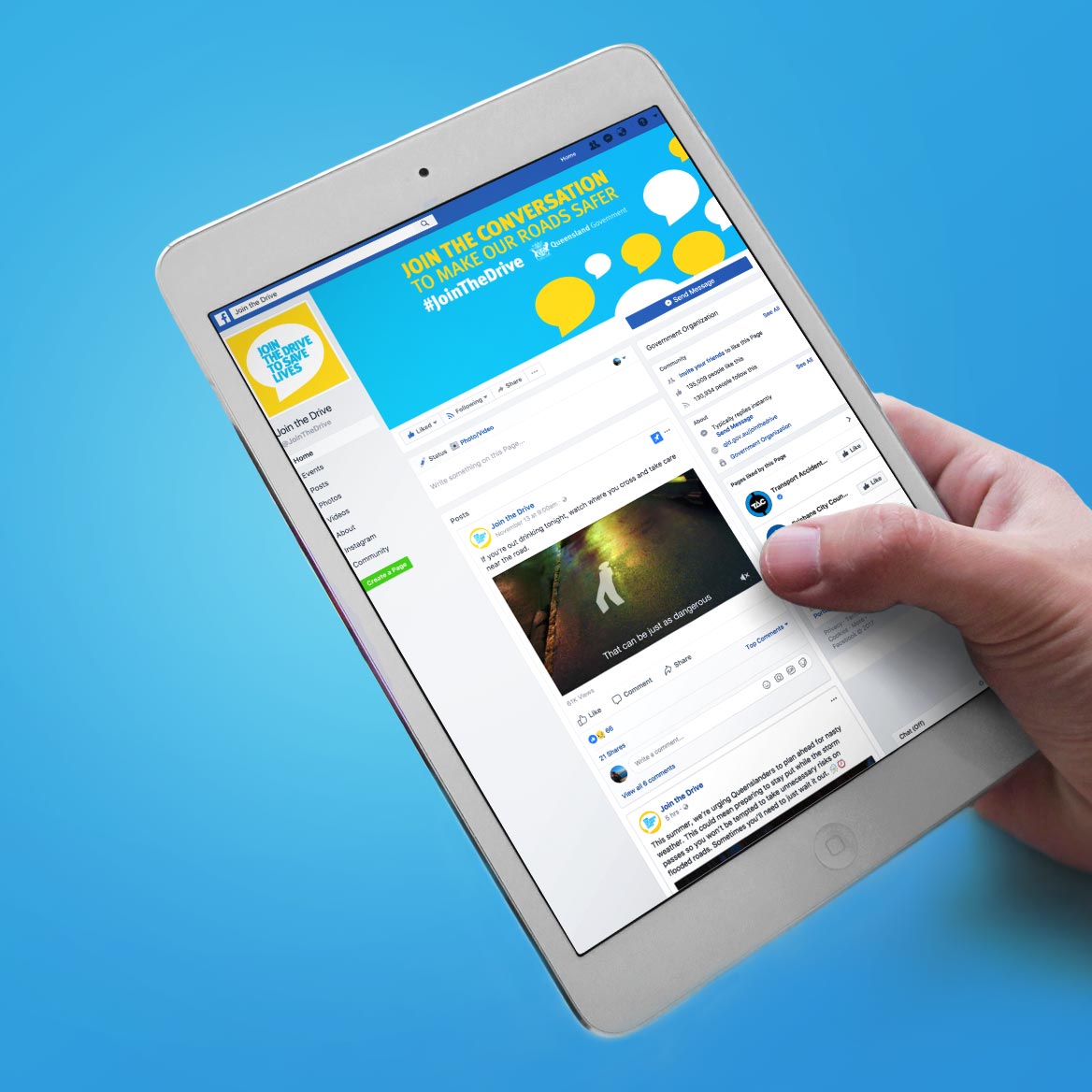 Hand holding an iPad with the Join The Drive website shown