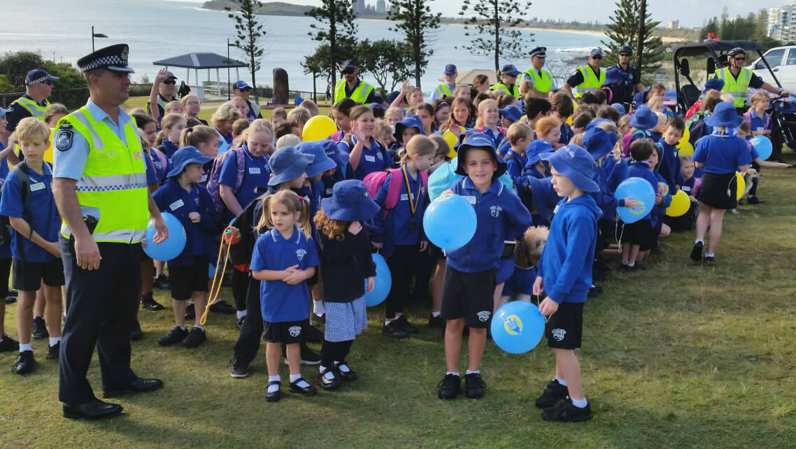 Police officer and children at event