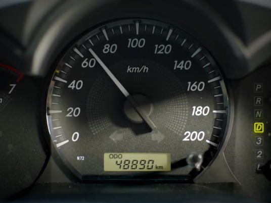 Car speedometer showing 65km/h