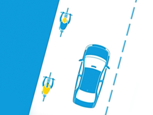 Overhead illustration showing cars passing a cyclist
