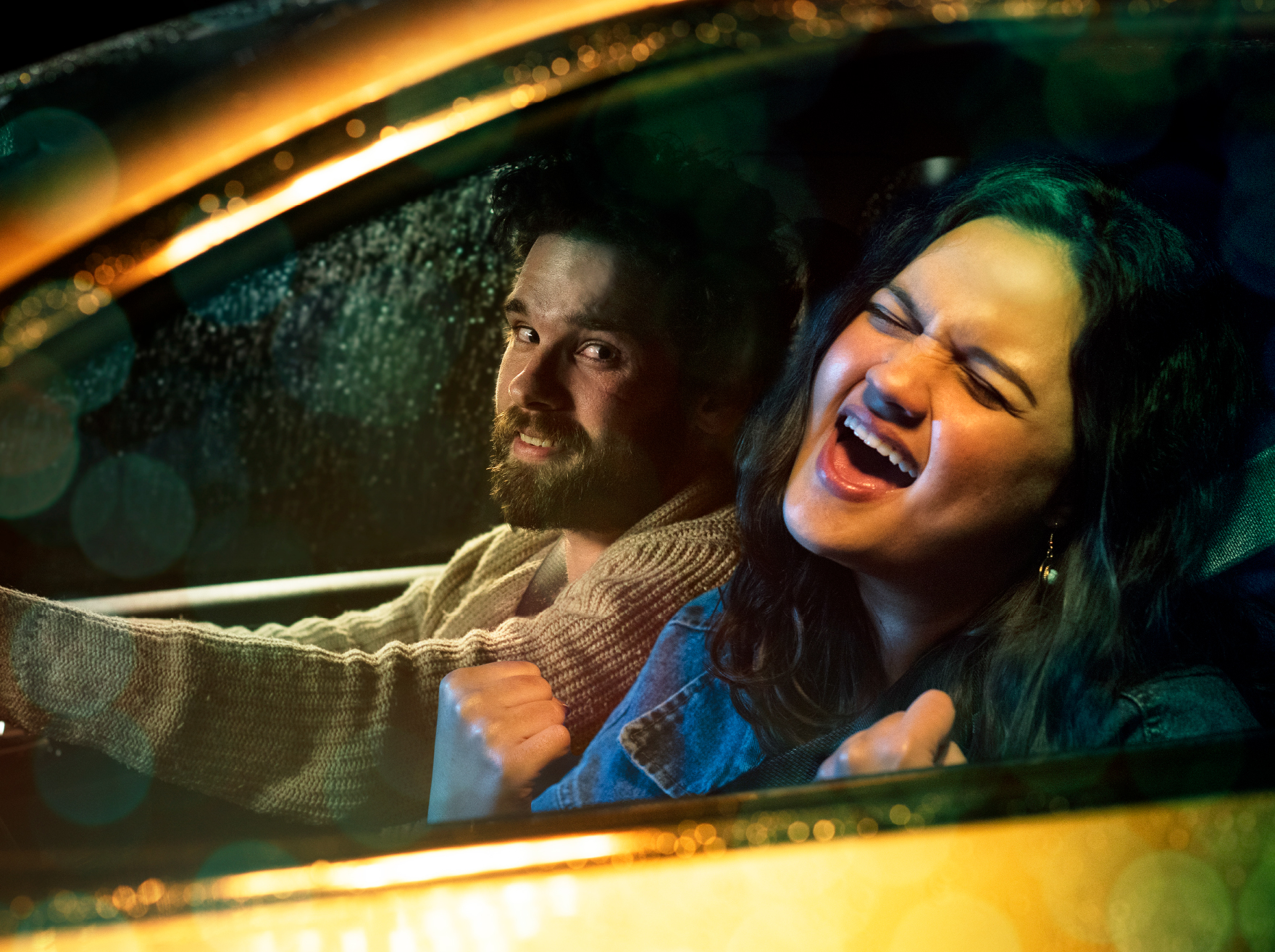 Woman singing inside a car