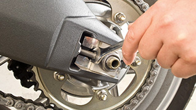 Motorcycle wheel with tool