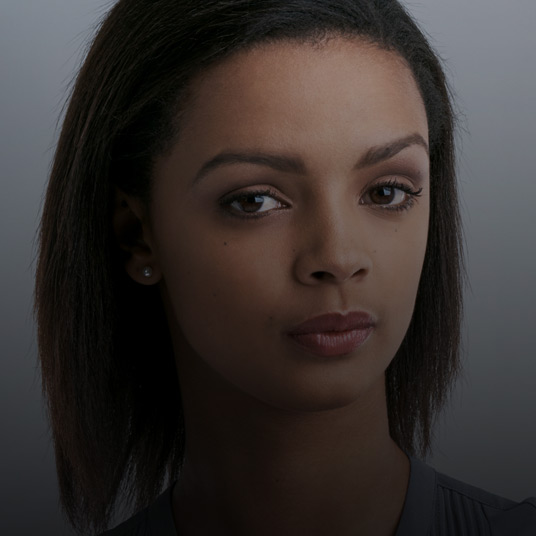View of young lady looking at the camera with seriously look on her face