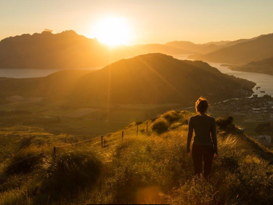 Woman overlook qtwn sunset