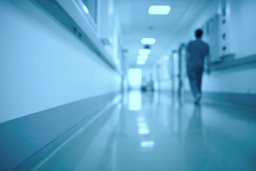 small_hospital 47049917 - blurred medical background. moving human figure in the hospital corridor