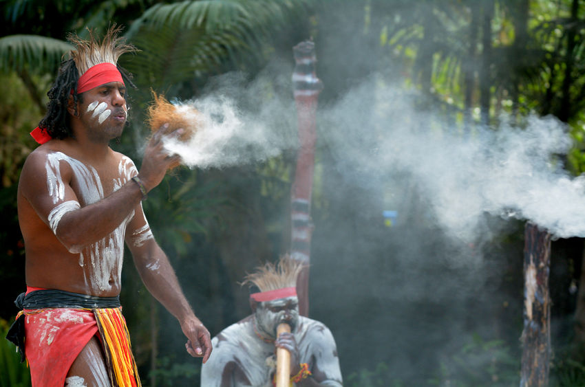 45816576_s 45816576 - yugambeh aboriginal warrior demonstrate fire making craft during aboriginal culture show in queensland, australia.