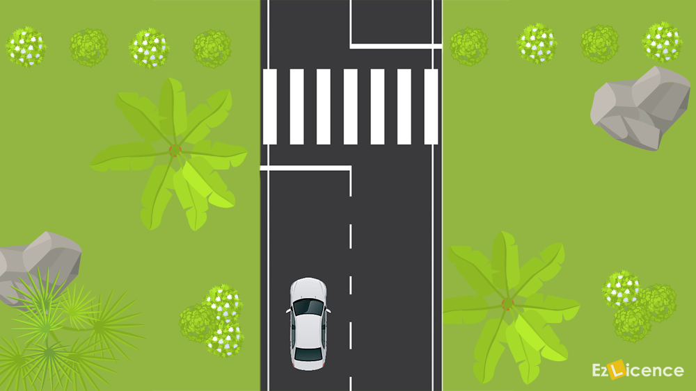 When approaching a marked pedestrian crossing and no pedestrians are in sight, you should -