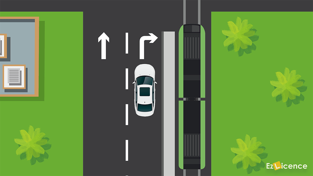 You want to drive on the tram tracks to turn right. A tram is in the tram lane next to you. What should you do?