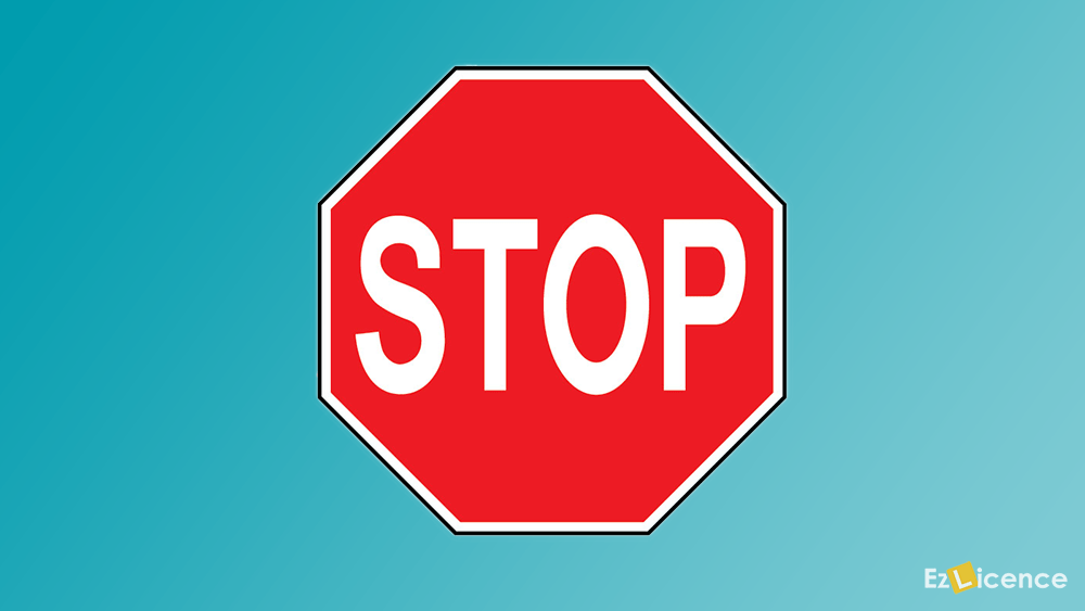 What must you do at a STOP sign?
