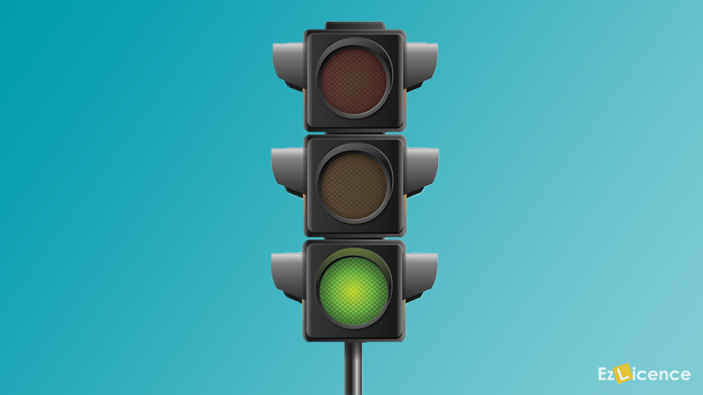 You are waiting at an intersection and the lights are red. The traffic lights change to green. You should-