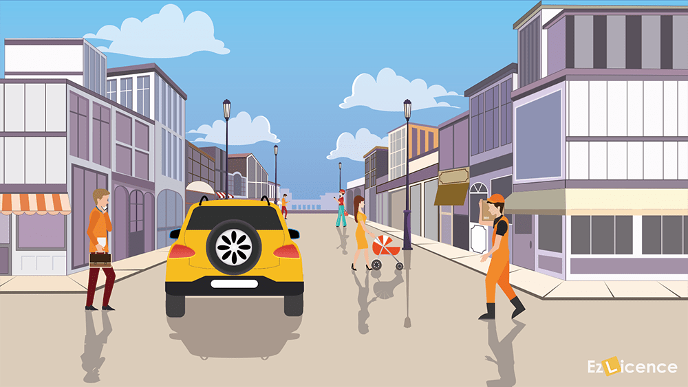 When driving in an area where there are many pedestrians (e.g. a bus stop) it is important to -