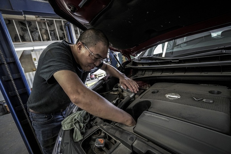 Mechanic working on a car engine
