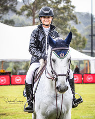 Maleah Lang-McMahon and 'Vakarra Champagne' win the class  in a time of 66.24 sec