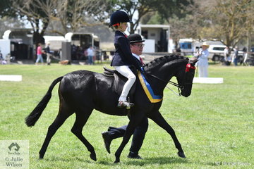 Ivy Aikman with some help from Jeremy Roberts won the class for Riding Pony Leading Rein Pony aboard, 'Langtree Unique'. They went on to claim the Riding Pony Child's Pony Reserve Championship.