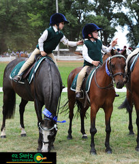 Winners of the Under 7 Pairs, Amelia Chick-Sauer riding Toby and Henry Rice riding Mighty Mouse, celebrate with a playful tug on one anothers helmet at the 2019 Kingstown Jamboree.