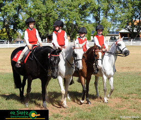 Joshua Bourke riding Oliver, William Schaefer riding Minty, Abbie Kelly riding Sir Leopold and Mackenzie Ellem riding Violet, take out first place in the Team of Four Sub-Junior class at the 2019 Kingstown Jamboree.