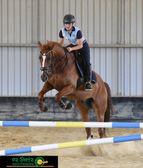 Showing us how it's done in her show jumping lesson with Becky Jenkins is Maddy Todorovski at Burpengary Summer School 2019.