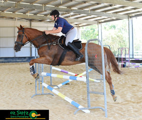 Cruising through her Becky Jenkins show jump lesson is Abbey Rashleigh at the Burpengary Summer School. 