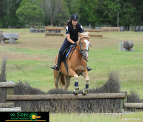 In her first cross country lesson with coach Rebel Morrow, Megan Anderson pushes herself and horse, Hunter over the ditch and brush at Burpengary Summer School.