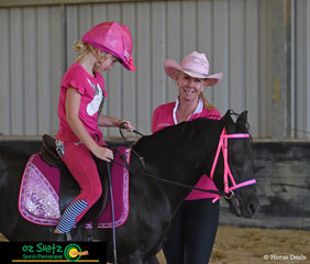 Sabrina Ewing stops for a chat with Show Horse Coach Kim Durante on Friday afternoon