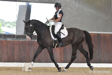 Kristy-Lee Brilliant is pitured aboard, 'Carrerai' during  round one of the Four Year Old Young Dressage Horse class.